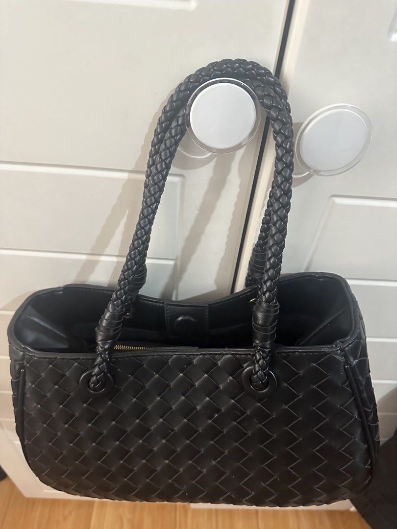Black Woven Leather Handbag with Braided Straps (Category: Shoulder Bags) located in Antipolo. Submitted by ririwearph (Listing ID 1464488993, Image 2). Description: - Bought in thailand and never used. - Stylish black woven leather handbag - Features elegant braided top handles - Includes a convenient detachable shoulder strap - Interior zippered pouch for organization - Secure magnetic snap closure - Spacious main compartment - Ideal for daily 