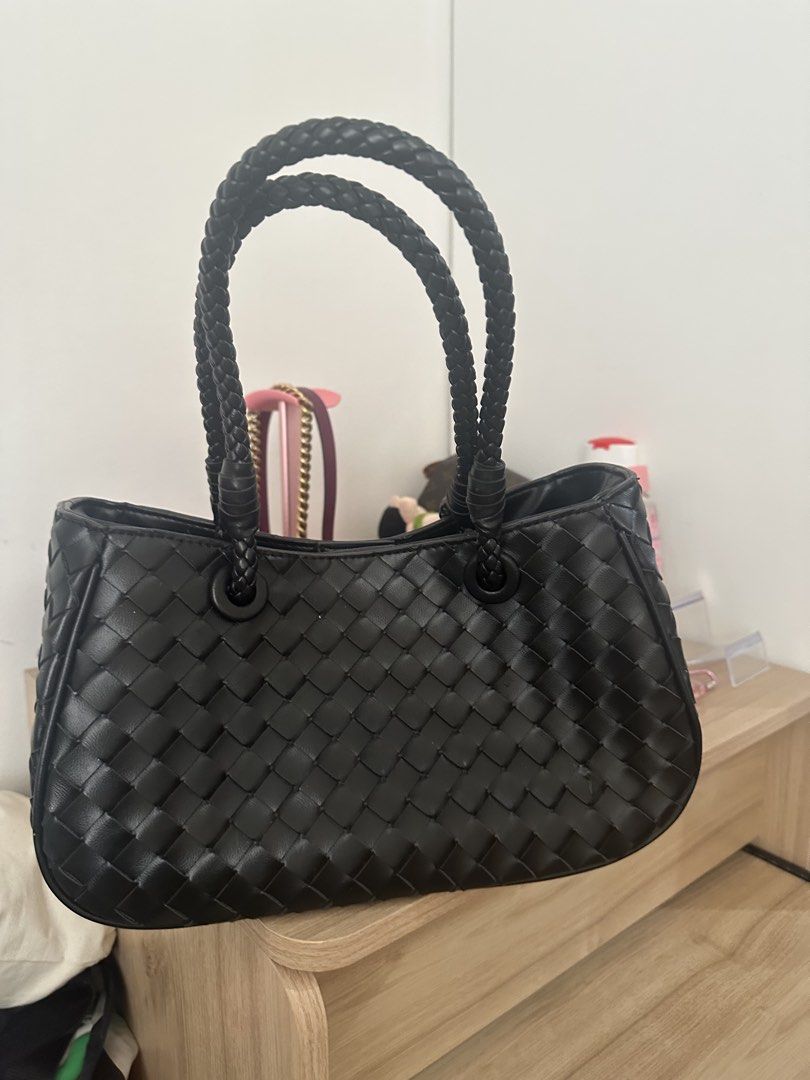 Black Woven Leather Handbag with Braided Straps (Category: Shoulder Bags) located in Antipolo. Submitted by ririwearph (Listing ID 1464488993, Image 1). Description: - Bought in thailand and never used. - Stylish black woven leather handbag - Features elegant braided top handles - Includes a convenient detachable shoulder strap - Interior zippered pouch for organization - Secure magnetic snap closure - Spacious main compartment - Ideal for daily 