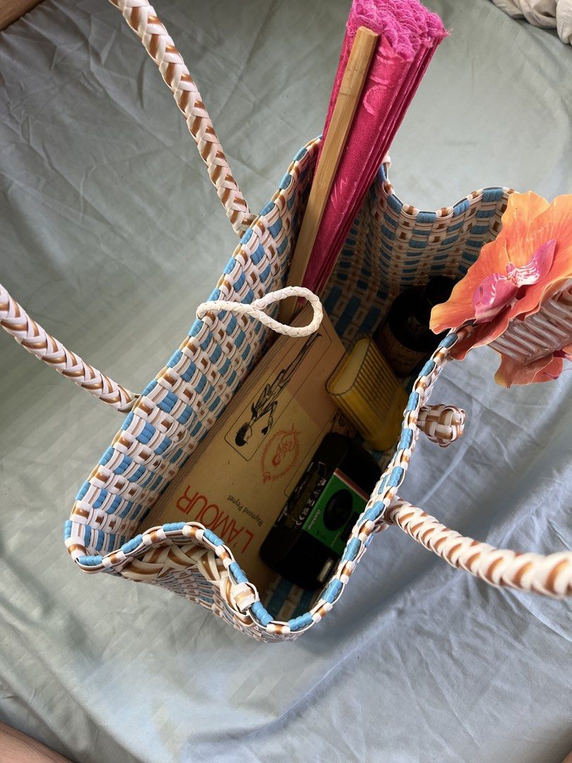 Blue and Tan Woven Rattan Bag (Category: Tote Bags) located in Iloilo. Submitted by warmspicyyy (Listing ID 1464371821, Image 3). Description: -Rattan bag bought from 🍊shop for 700 pesos - used once from my elyu trip - Braided handles - very spacious inside, can fit all of your beach essentials - Ideal for beach days or everyday use.