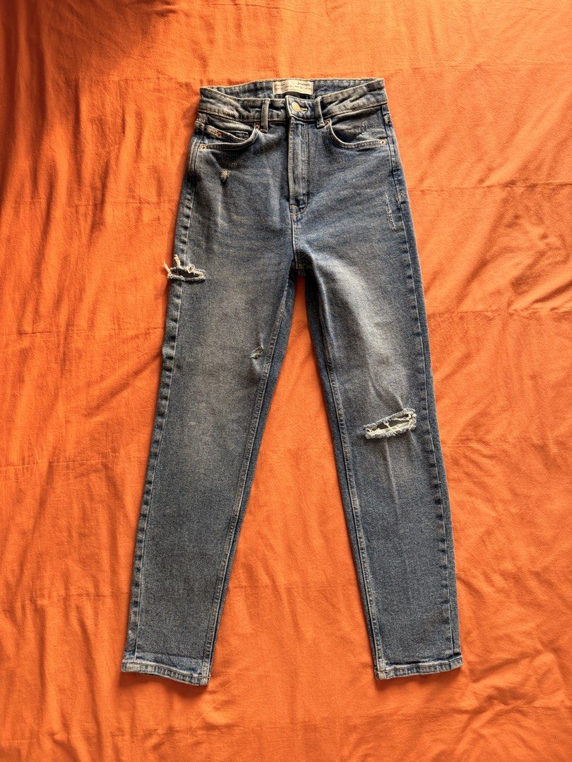 Blue Denim Jeans with Rips (Category: Jeans) located in Manila. Submitted by pvreal (Listing ID 1464445076, Image 1). Description: - Classic blue denim jeans - Mom slim cut - Distressed rips on knees and thigh area - Two front pockets, two back pockets - Button and zip closure - Comfortable for everyday wear.