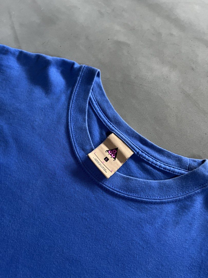 Blue Embroidered ACG Tee (Category: Tshirts & Polo Shirts ) located in Manila. Submitted by nofuckingli (Listing ID 1464375368, Image 2). Description: Blue Embroidered ACG Tee Length: 28.5 Width: 20 Best Fit: M–L no issue, makapal tela, very good condition Color Rate: 9/10 Condition: 10/10.