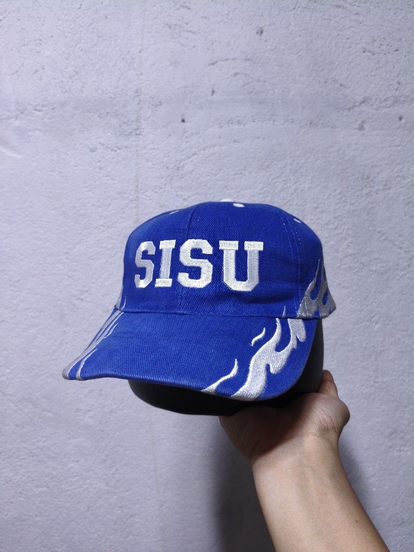 Blue SISU Flames Otto Cap (Category: Caps & Hats) located in Malilipot. Submitted by aronbigorn96320 (Listing ID 1464489534, Image 1). Description: - Blue cap with SISU text and flame design - 100% Cotton material - One size fits most - Adjustable strap at the back for a comfortable fit - Note: Some loose threads visible on the inside seam.