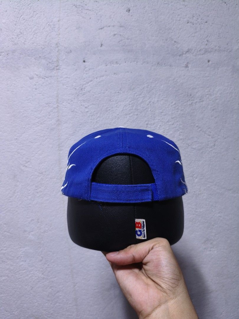 Blue SISU Flames Otto Cap (Category: Caps & Hats) located in Malilipot. Submitted by aronbigorn96320 (Listing ID 1464489534, Image 2). Description: - Blue cap with SISU text and flame design - 100% Cotton material - One size fits most - Adjustable strap at the back for a comfortable fit - Note: Some loose threads visible on the inside seam.