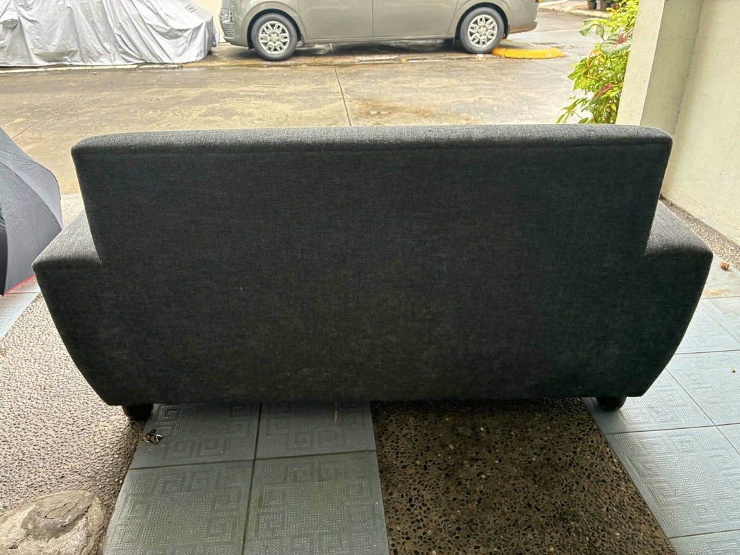 Blue/grey 2-Seater Sofa (Category: Sofas) located in Pasig City. Submitted by jorgeboy9748 (Listing ID 1464371506, Image 3). Description: - 2-seater sofa - Simple, modern design - Textured fabric upholstery - Slightly curved backrest - wooden frame & legs - Ideal for apartments and smaller rooms - Pick up only.