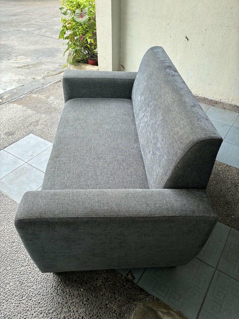 Blue/grey 2-Seater Sofa (Category: Sofas) located in Pasig City. Submitted by jorgeboy9748 (Listing ID 1464371506, Image 1). Description: - 2-seater sofa - Simple, modern design - Textured fabric upholstery - Slightly curved backrest - wooden frame & legs - Ideal for apartments and smaller rooms - Pick up only.