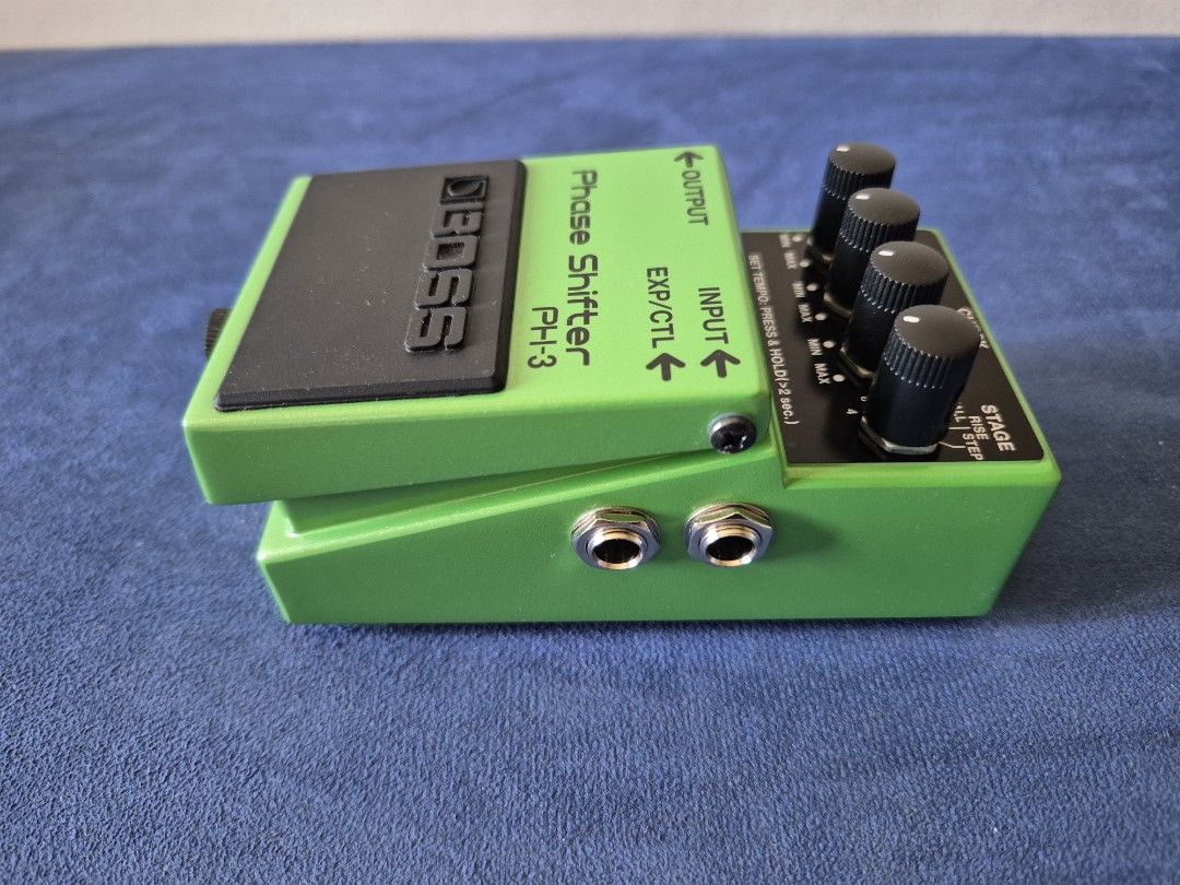 BOSS PH-3 Phase Shifter Guitar Pedal (Category: Musical Instruments) located in Bantay. Submitted by backyardcyclist (Listing ID 1464378999, Image 3). Description: - BOSS PH-3 Phase Shifter pedal - Classic green stompbox design - Adds phasing effects to your guitar sound - Controls: RATE, CHECK, STAGE, RISE knobs - Includes tempo setting function - Has Input, Output, and EXP/CTL jacks.