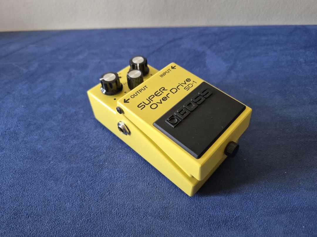 BOSS SD-1 Super Overdrive Guitar Pedal (Category: Musical Instruments) located in Bantay. Submitted by backyardcyclist (Listing ID 1464377997, Image 3). Description: - Classic BOSS SD-1 Super Overdrive pedal - Iconic yellow finish - Controls: Level, Tone, Drive - Adds grit and sustain to guitar tone - Tested and fully functional.