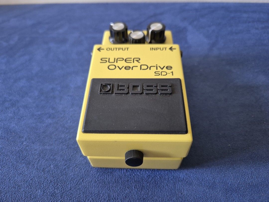 BOSS SD-1 Super Overdrive Guitar Pedal (Category: Musical Instruments) located in Bantay. Submitted by backyardcyclist (Listing ID 1464377997, Image 2). Description: - Classic BOSS SD-1 Super Overdrive pedal - Iconic yellow finish - Controls: Level, Tone, Drive - Adds grit and sustain to guitar tone - Tested and fully functional.