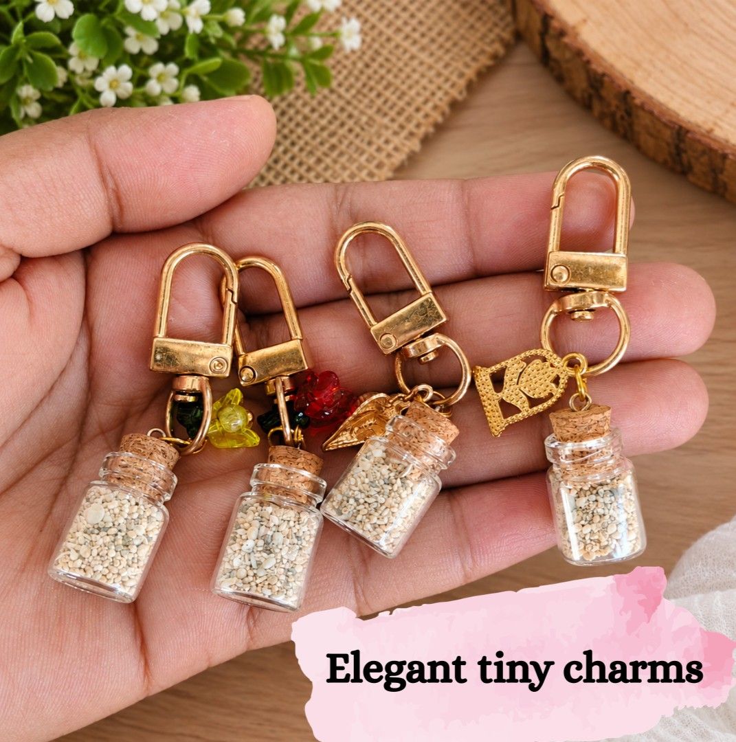 Bottle keychains (Category: Charms) located in Burgos, Ilocos Norte. Submitted by lumayra. (Listing ID 1464403988, Image 2). Description: 🌊 Handmade Beach-Themed Keychain 🐚✨ Bring a little piece of the beach wherever you go! 🏝️ This cute handmade keychain features seashell charms, a starfish design, silver rings and chains, and mini glass bottles filled with beach sand/pebbles. Each detail gives it a unique coastal and souvenir-inspired look. 