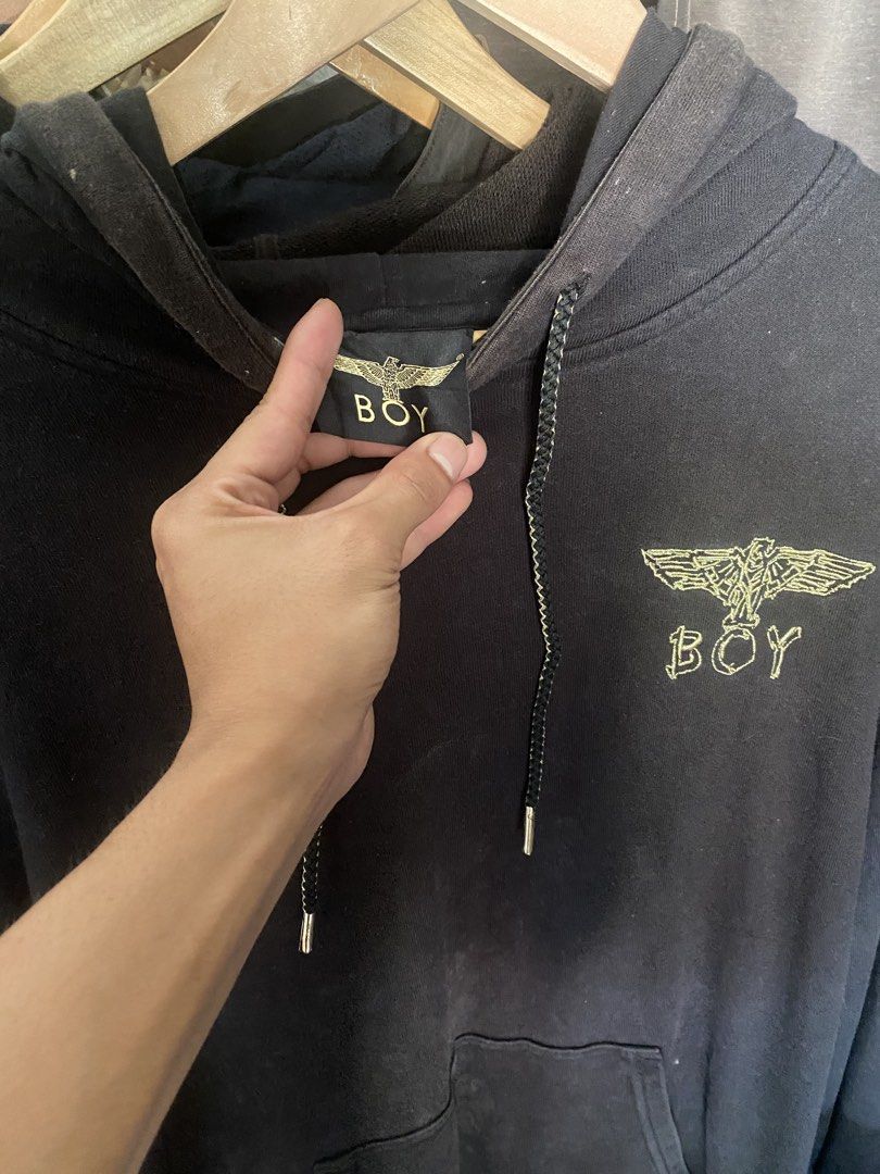 BOY LONDON Black Hoodie Eagle Graphic (Category: Coats, Jackets and Outerwear) located in Manila. Submitted by jrofit (Listing ID 1464390697, Image 2). Description: - Boy London black hoodie - Iconic eagle graphic on front and back - Gold detailing on graphics and drawstrings - Kangaroo pocket - Perfect for Boy London fans.