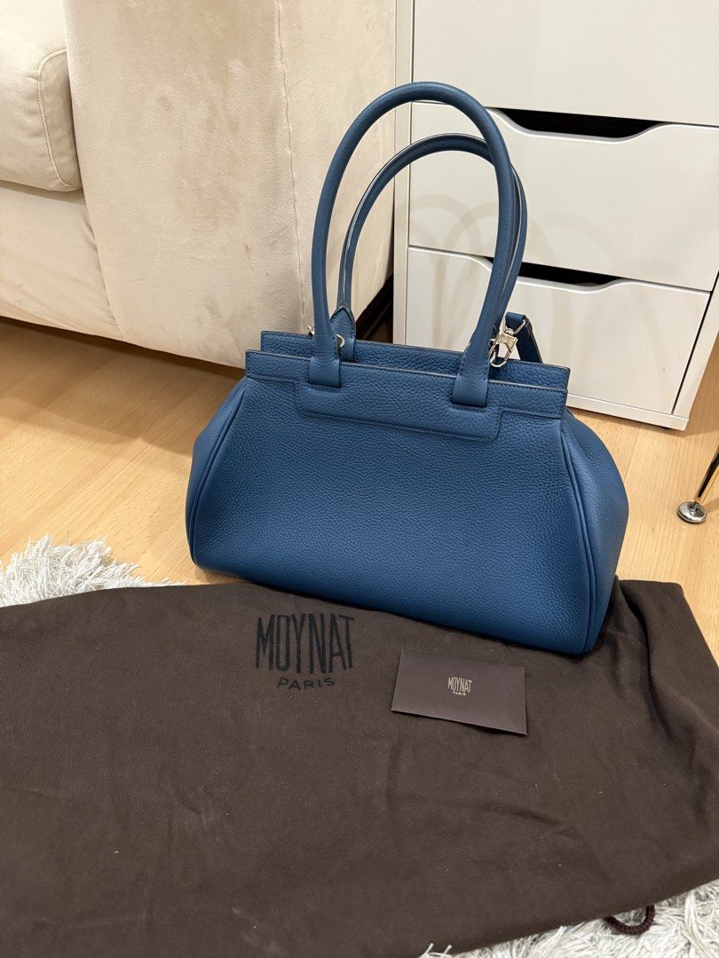 Brandnew Authentic Moynat Blue Top handle bag (Category: Shoulder Bags) located in Quezon City. Submitted by emily_in_pariss (Listing ID 1464427168, Image 1). Description: * Moynat Top Handle Bag * Blue Leather * Silver-Tone Hardware * Rolled Handles & Single Adjustable Shoulder Strap * Leather Lining & Three Interior Pockets * Zip Closure at Top * Protective Feet at Base * Includes Dust Bag & Clochette.