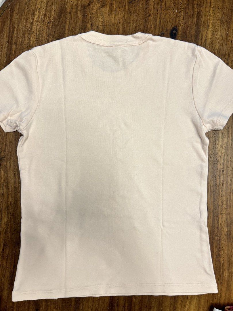 Brandy Melville Top (Category: Shirts) located in Manila. Submitted by tshopph (Listing ID 1464387422, Image 2). Description: Brandy Melville Light Pink Basic Fitted Tee Classic, soft, and versatile short-sleeve tee in a gentle light pink shade. An essential wardrobe staple for casual days, lounging, or layering under jackets and cardigans Condition: like new Size: one-size Price: ₱500, negotiable Same-day delivery via Lalamove / Grab (buyer pays