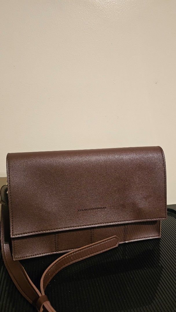 Brown Leather Wallet with Strap (Category: Wallets & Card holders) located in Cebu City. Submitted by sherosales (Listing ID 1464355411, Image 2). Description: Straightforward Crossbody Bag Almost never used In very good condition RFS: Decluttering.