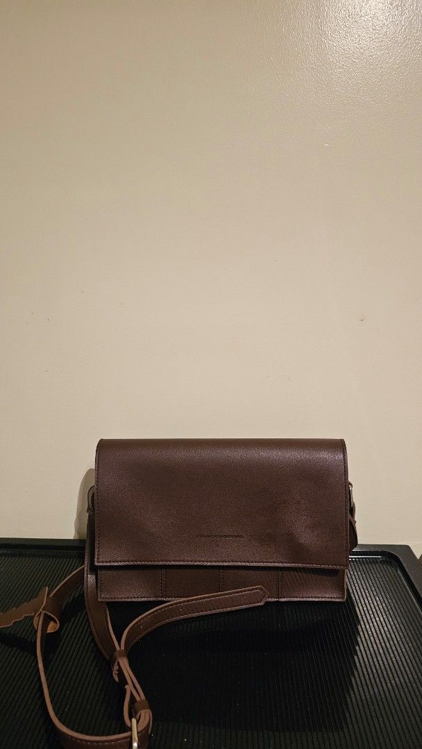 Brown Leather Wallet with Strap (Category: Wallets & Card holders) located in Cebu City. Submitted by sherosales (Listing ID 1464355411, Image 1). Description: Straightforward Crossbody Bag Almost never used In very good condition RFS: Decluttering.