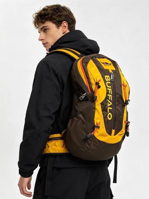 Buffalo Outdoor Hiking Backpack Yellow Brown (Category: Backpacks) located in City of Isabela. Submitted by warmbird.d06e6f (Listing ID 1464428563, Image 1). Description: - Buffalo brand backpack - Ideal for hiking and travel - Multiple pockets and gear straps - Yellow and brown colorway - Zippers in good working condition - Adjustable straps for comfort - Suitable for day trips or weekend getaways.