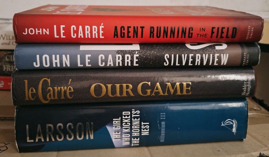 Bundle: John le Carré & Stieg Larsson Books (Category: Storybooks) located in Marikina City. Submitted by hellobookish.ph (Listing ID 1464442910, Image 2). Description: Take all for ₱180 preloved hardcover thriller novels John le Carré and Stieg Larsson + free 3 random books (with tanning and foxing).
