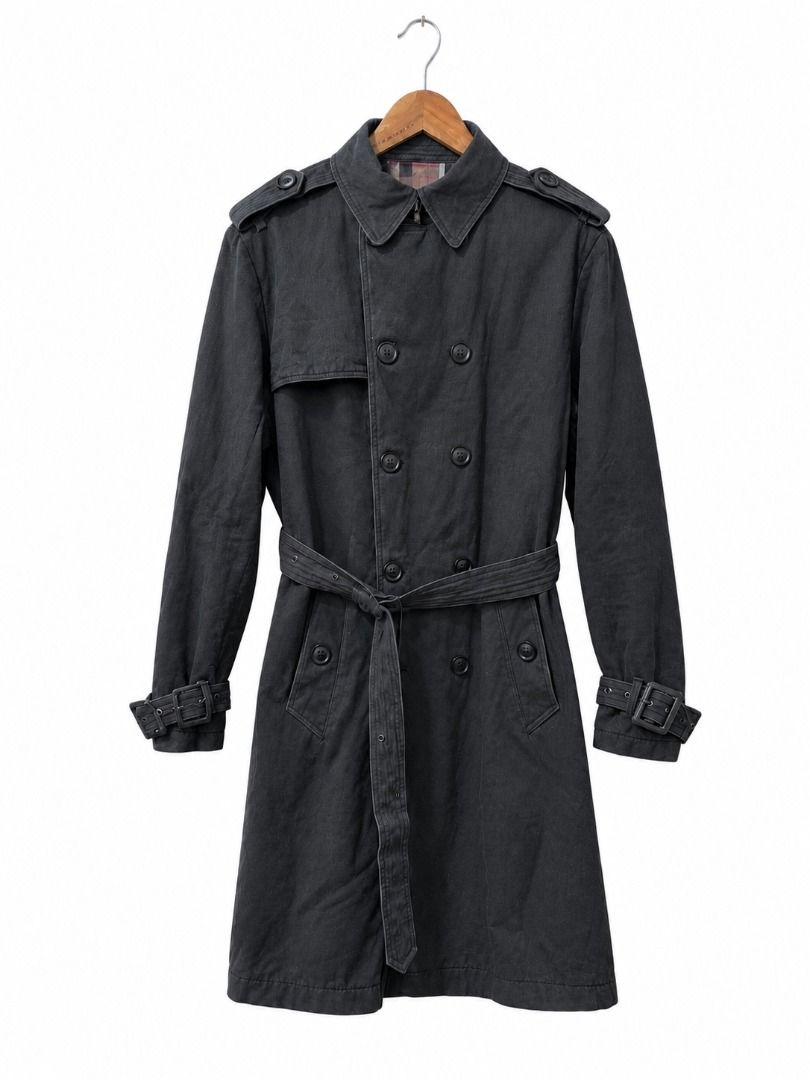 Burberry Black Double-Breasted Trench Coat (Category: Coats, Jackets and Outerwear) located in Caloocan City. Submitted by silentstorm_cf9f0a (Listing ID 1464509902, Image 1). Description: Style: Double-breasted trench coat with waist tie Color: Faded / Charcoal Black Size: Tagged as XXXL Features: Shoulder epaulets, gun flap, belted cuffs, checked pattern interior lining accent. Condition: Gently worn with a nice vintage, broken-in wash look. Is