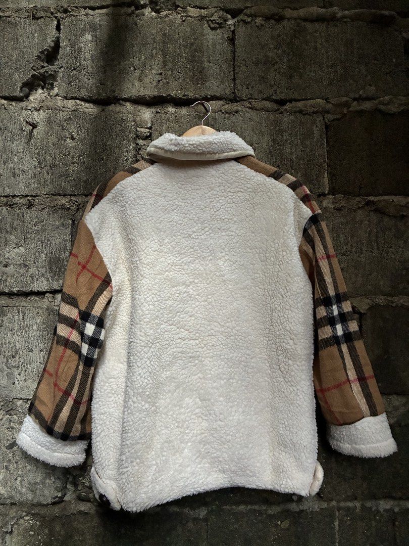 Burberry Checkered Fleece Jacket (Category: Coats, Jackets and Outerwear) located in Manila. Submitted by assortedgoodsv3 (Listing ID 1464461814, Image 2). Description: - Authentic Burberry jacket - Iconic checkered pattern - Cozy fleece lining - Button closure - Two front pockets - Made in Italy.