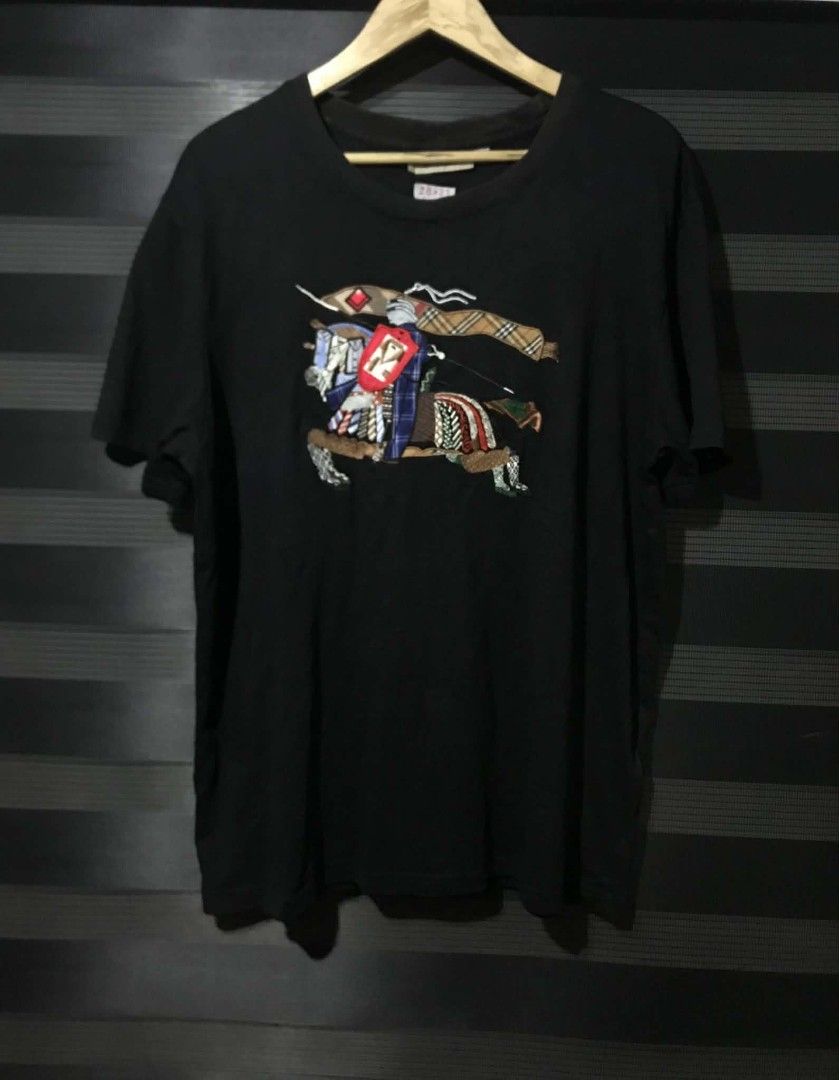 Burberry embroidered logo tshirt (Category: Tshirts & Polo Shirts ) located in Caloocan City. Submitted by anthriftdepot (Listing ID 1464539833, Image 1). Description: Dimes 28x23 (xxxl on tag) Best fit XL Very good condition No major issue Color rate 9.5/10 Slightly fade neck line See photo for reference North Caloocan area.