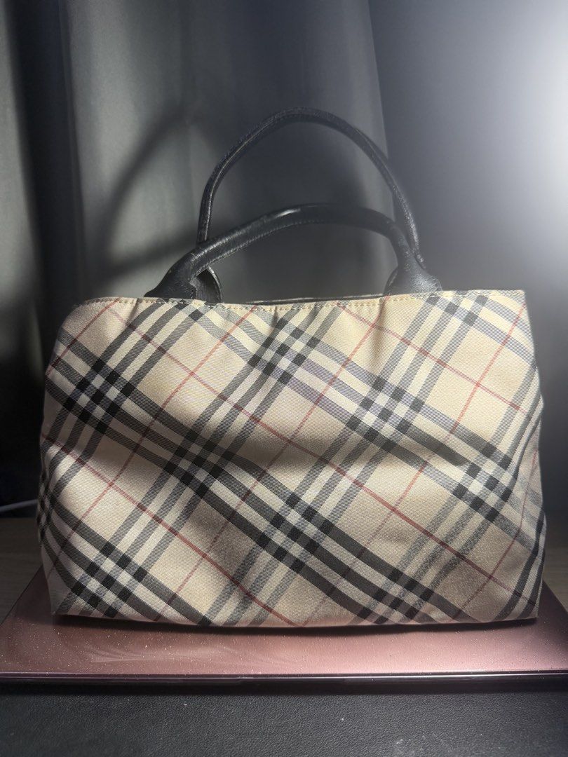 Burberry Nova Check Blue Label beige bag (Category: Tote Bags) located in Pasig City. Submitted by fancytracy (Listing ID 1464464917, Image 1). Description: Brand: Burberry Blue Label Model: Burberry Nova Check Blue Label beige bag Color: Beige Hardware: Silver Material: Nylon Condition: Good Dimensions: 25 x 16 x 18 cm (L x W x H) Handle drop: 10 cm Thrifted from Japan Pre-owned Burberry Nova Check Blue Label beige bag This pre-owned Burberry No