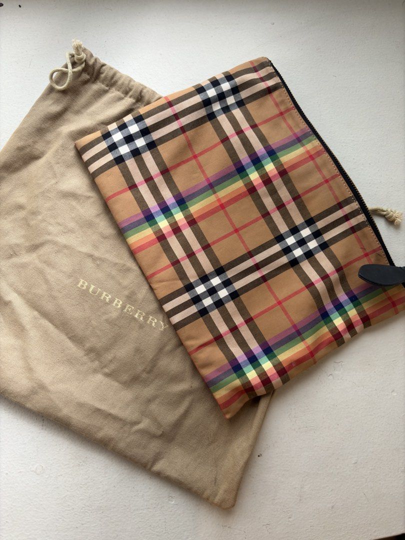 Burberry Rainbow Check Zip Pouch (Category: Luxury Bags & Wallets) located in Mandaluyong City. Submitted by material_boi (Listing ID 1464411944, Image 1). Description: Made in Italy. Maganda siya super soft and smooth. Main material is 100% cotton and then leather trims. Brass-gold yung zipper. This is flat and not structured. Approx 12 inches wide and 9 inches long. No issues. May random dirt lang di maiiwasan lasi cotton yan. Code is: CFPCXP12