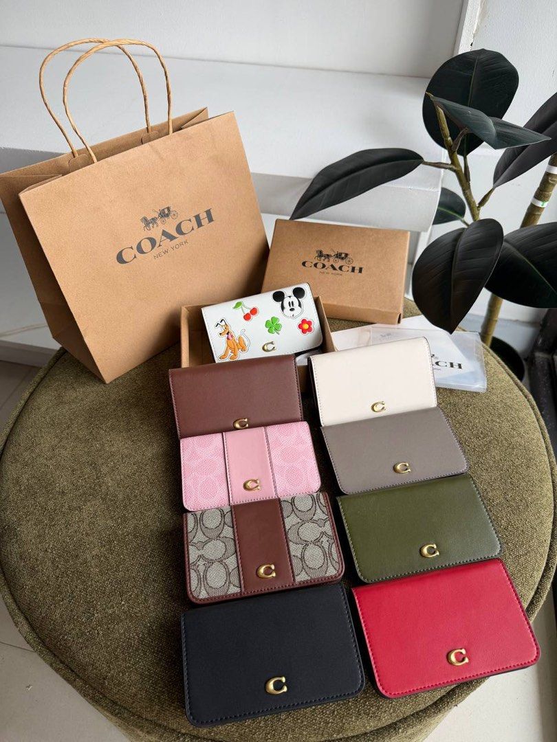 C0ach Slimcard Case (Category: Wallets & Card holders) located in Manila. Submitted by whimsy.finds (Listing ID 1464530640, Image 1). Description: Payment first basis via Gcash / Maribank / Maya Ship via JNT ONLY *No rush shipping *Open for bulk order.
