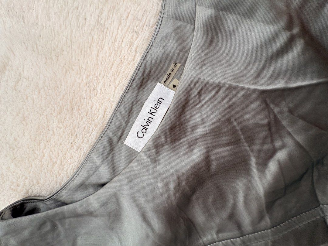Calvin Klein Seamed Shutter Pleats Tin Silver Stretch Satin (Category: Dresses) located in Manila. Submitted by jean777_love (Listing ID 1464355251, Image 3). Description: ✅very likenew condition .
