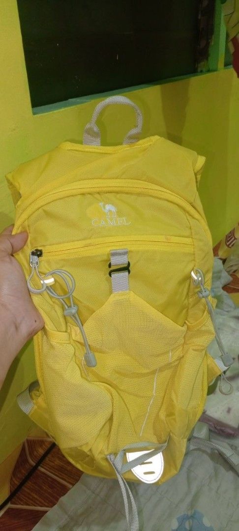 Camel Yellow Lightweight Hiking Backpack (Category: Backpacks) located in Manila. Submitted by honey010 (Listing ID 1464436647, Image 1). Description: - Lightweight and foldable Yellow Camel backpack - Multiple pockets for organization - Mesh side pouches for water bottles or essentials - Ideal for day trips, travel, hiking, and casual use - Easily packs away when not in use.