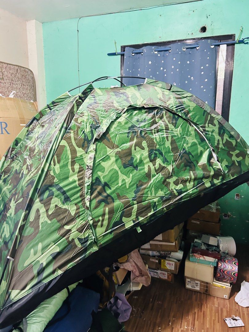 Camouflage Camping Tent Single (Category: Hiking & Camping) located in Manila. Submitted by starbalesukandjapansurplus (Listing ID 1464406004, Image 2). Description: - Green camouflage design - Simple and quick setup - Mesh windows for excellent ventilation - Perfect for camping and outdoor adventures - Folds compactly for easy storage - Made with durable materials.
