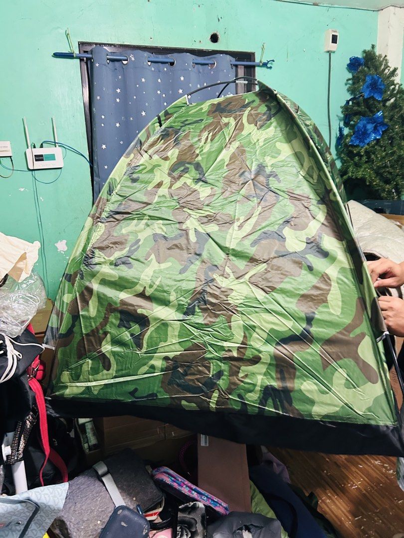 Camouflage Camping Tent Single (Category: Hiking & Camping) located in Manila. Submitted by starbalesukandjapansurplus (Listing ID 1464406004, Image 3). Description: - Green camouflage design - Simple and quick setup - Mesh windows for excellent ventilation - Perfect for camping and outdoor adventures - Folds compactly for easy storage - Made with durable materials.