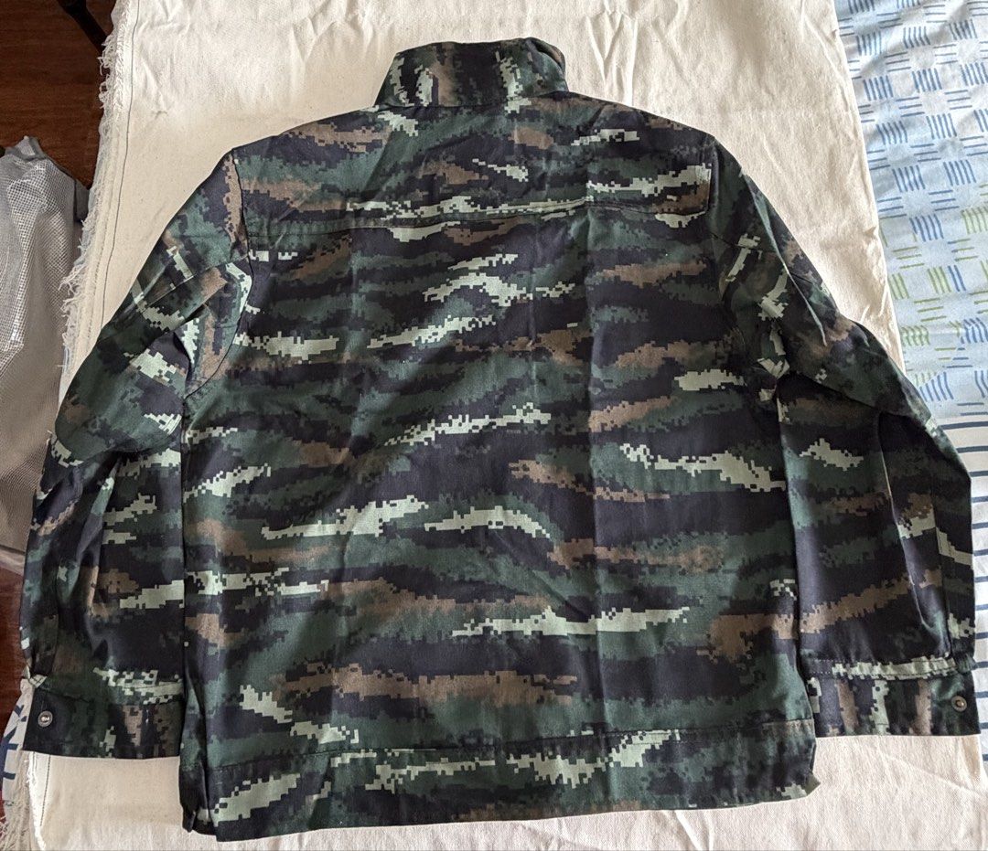 camouflage jacket and pants costume (Category: Coats, Jackets and Outerwear) located in Makati City. Submitted by aubsmartin (Listing ID 1464395263, Image 2). Description: jacket measurements: 48” waist 21” length from shoulder 14” sleeve length pants measurements: 28” waist 36” length from waist - Jacket features zip and button closure with chest pockets - Pants button fly with cargo pockets - Sold as a complete set.