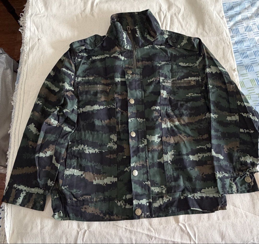 camouflage jacket and pants costume (Category: Coats, Jackets and Outerwear) located in Makati City. Submitted by aubsmartin (Listing ID 1464395263, Image 1). Description: jacket measurements: 48” waist 21” length from shoulder 14” sleeve length pants measurements: 28” waist 36” length from waist - Jacket features zip and button closure with chest pockets - Pants button fly with cargo pockets - Sold as a complete set.