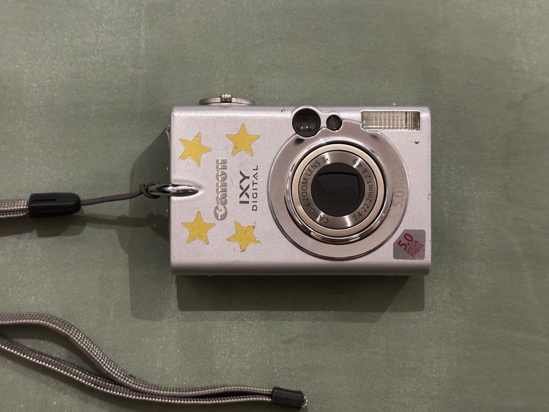 Canon IXY DIGITAL 5.0 Megapixels Camera with Accessories (Category: Cameras) located in Quezon City. Submitted by stroberi444 (Listing ID 1464408750, Image 1). Description: - Silver Canon IXY DIGITAL camera - 5.0 Megapixels - 3x Optical Zoom - Includes: Battery charger, 512MB Transcend CompactFlash card, original software CDs - Original box included - Ideal for casual photography.
