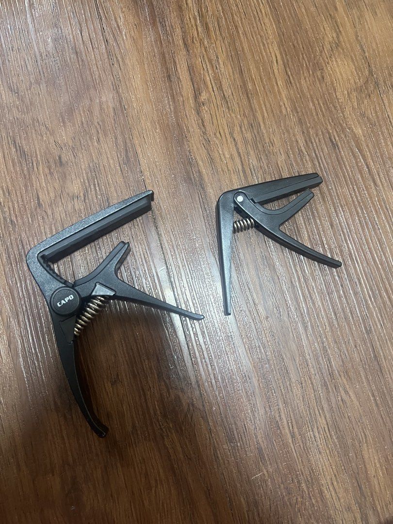 Capo Set (Ukelele+Guitar) (Category: Musical Instruments) located in Las Pinas. Submitted by TWMall (Listing ID 1464441846, Image 1). Description: Selling both for ₱150! Ukelele and Guitar Capo on hand .