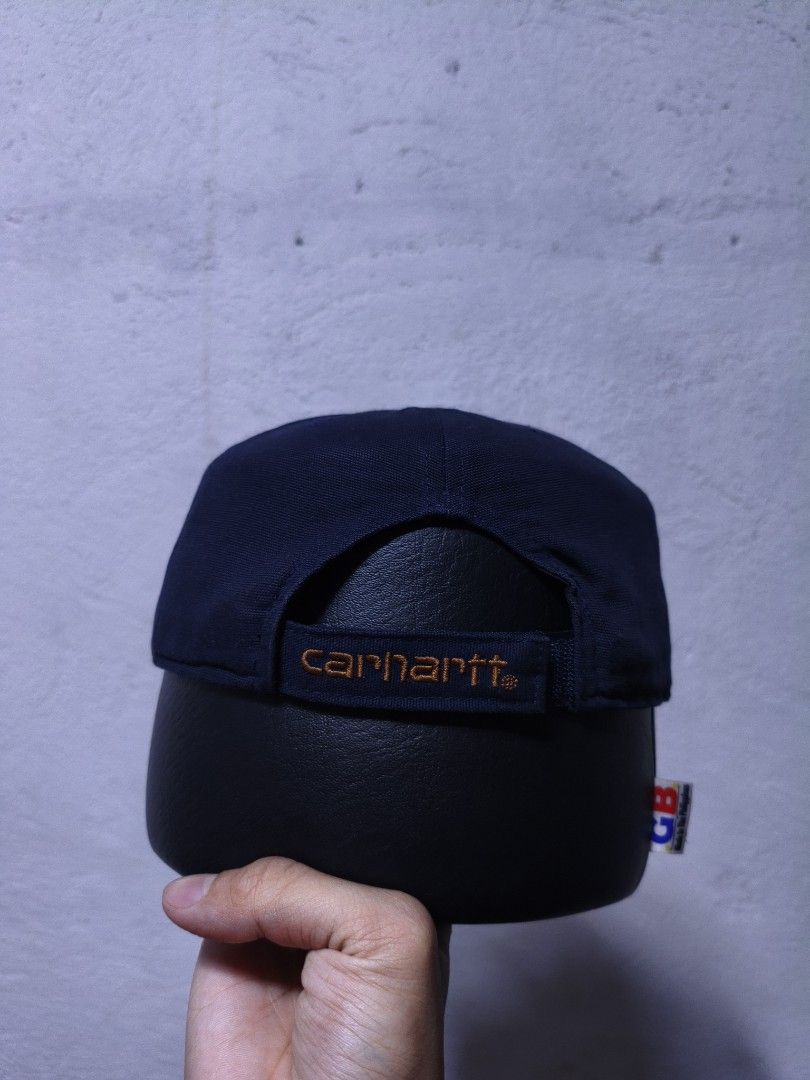Carhartt Navy Blue Cap (Category: Caps & Hats) located in Malilipot. Submitted by aronbigorn96320 (Listing ID 1464470249, Image 3). Description: - Navy blue cap with white 'SH' embroidery - 'Mi Casa Su Casa' text detail - Carhartt logo on side and back - Made from 100% cotton - From the Spring 2023 collection - Adjustable strap for a comfortable fit.
