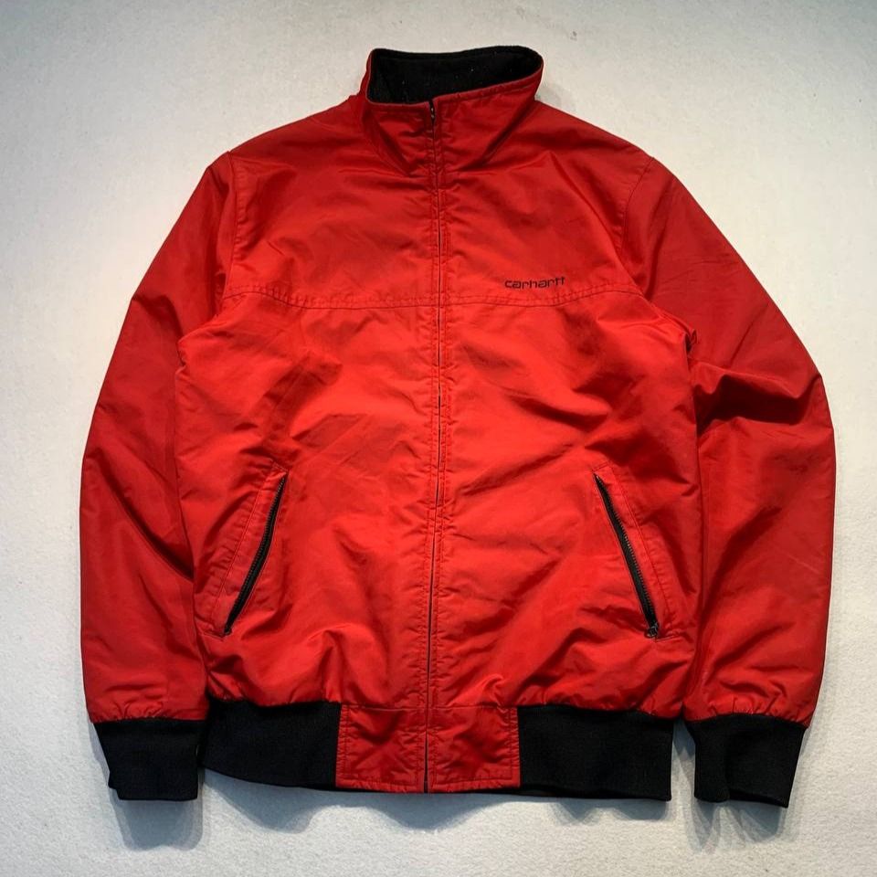 Carhartt Red Bomber Jacket (Category: Coats, Jackets and Outerwear) located in Mandaluyong City. Submitted by theroom501 (Listing ID 1464550624, Image 1). Description: Carhartt Red Bomber Jacket Style Code: Workwear Jacket Size on Tag: Small Color: Red/ Black Condition: Good pre-owned condition. The jacket shows signs of previous use, with visible creasing and wrinkles throughout the fabric. Flaws/Issues: The zipper pull tab is damaged/torn. Flat