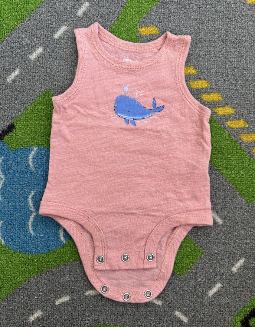 Carter's Onesie Bodysuit (Category: Babies & Kids Fashion) located in Rizal. Submitted by preloovved (Listing ID 1464391506, Image 1). Description: Cute tank top bodysuit for baby with a blue whale graphic. Easy snap closure. Carter's brand. Carter’s whale onesie. Sleeveless and snap closures for easy changes. Adorable for your baby! Preloved, newborn Meet-up only in GB1 San Mateo, Rizal Shipping fee c/o buyer. Tres Marias or J&T express Payment 