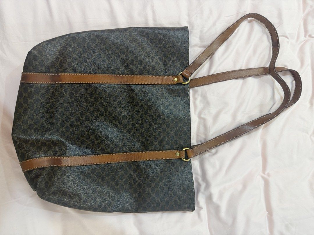 Celine Macadam Monogram Tote Bag (Category: Luxury Bags & Wallets) located in Santa Rosa. Submitted by decluttering_. (Listing ID 1464468335, Image 3). Description: - AUTHENTIC Classic Celine tote bag - Iconic Macadam monogram print - Brown leather trim and straps - Spacious interior, great for everyday or travel - Shows some signs of wear on leather (straps/trim), consistent with age and use - Timeless Celine piece.