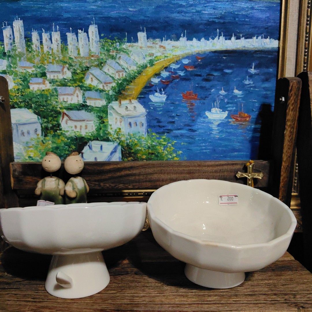 Ceramic snacks or fruit bowl (Category: Other Kitchenware & Tableware) located in Calamba. Submitted by princesspauliney. (Listing ID 1464457788, Image 1). Description: white ceramic footed bowl designed with a distinctive multi-faceted or panelled body and a matching pedestal base. This style of high-sided, stemmed tableware is widely utilized as a dessert cup, small compote dish, or a decorative footed presentation bowl for fruits and snacks. 2