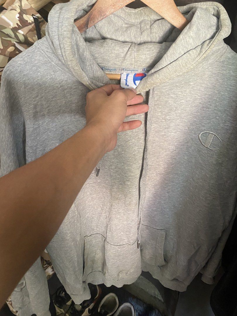 Champion Grey Hoodie (Category: Hoodies) located in Manila. Submitted by jrofit (Listing ID 1464391022, Image 2). Description: - Classic grey Champion hoodie - Features iconic embroidered logo on the chest - Convenient front kangaroo pocket - Adjustable drawstrings for the hood - Comfortable and casual, ideal for everyday wear.