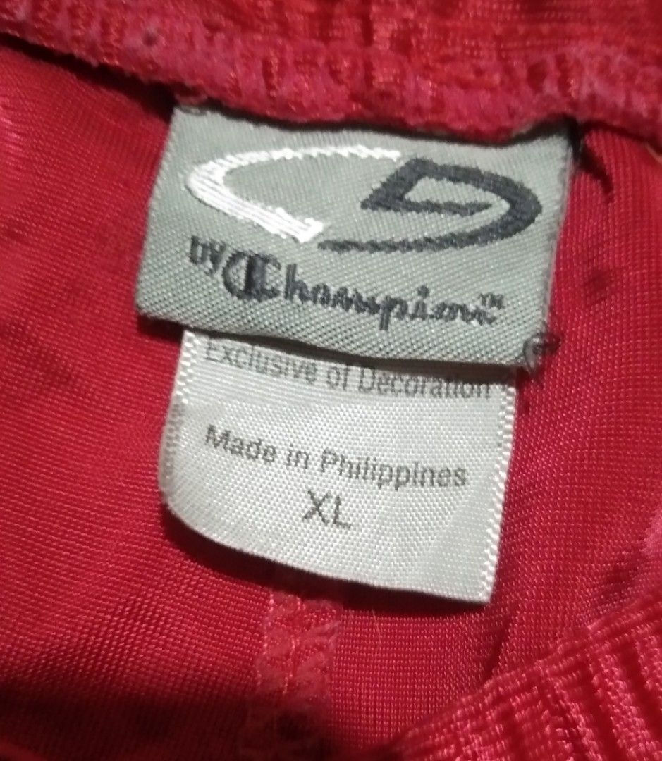 Champion Red Athletic Shorts XL (Category: Shorts) located in Quezon City. Submitted by aljonbermu25659 (Listing ID 1464360526, Image 3). Description: - Champion athletic shorts - Color: Red - Size: XL - Features: Elastic waistband with drawstring, white piping detail on sides - Versatile: Great for sports or casual wear - Locally made: Proudly made in the Philippines.