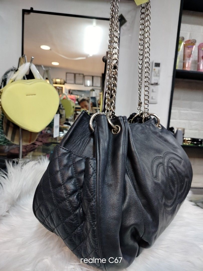 Chanel Black Leather Chain Shoulder Bag (Category: Luxury Bags & Wallets) located in Bacolod City. Submitted by Mike23MattPreloved (Listing ID 1464493268, Image 2). Description: - Genuine black leather Chanel bag - Iconic embossed CC logo on the front - Quilted detail on the side pocket - Elegant silver chain straps - Roomy interior for all your essentials - Versatile for daily wear or special events.
