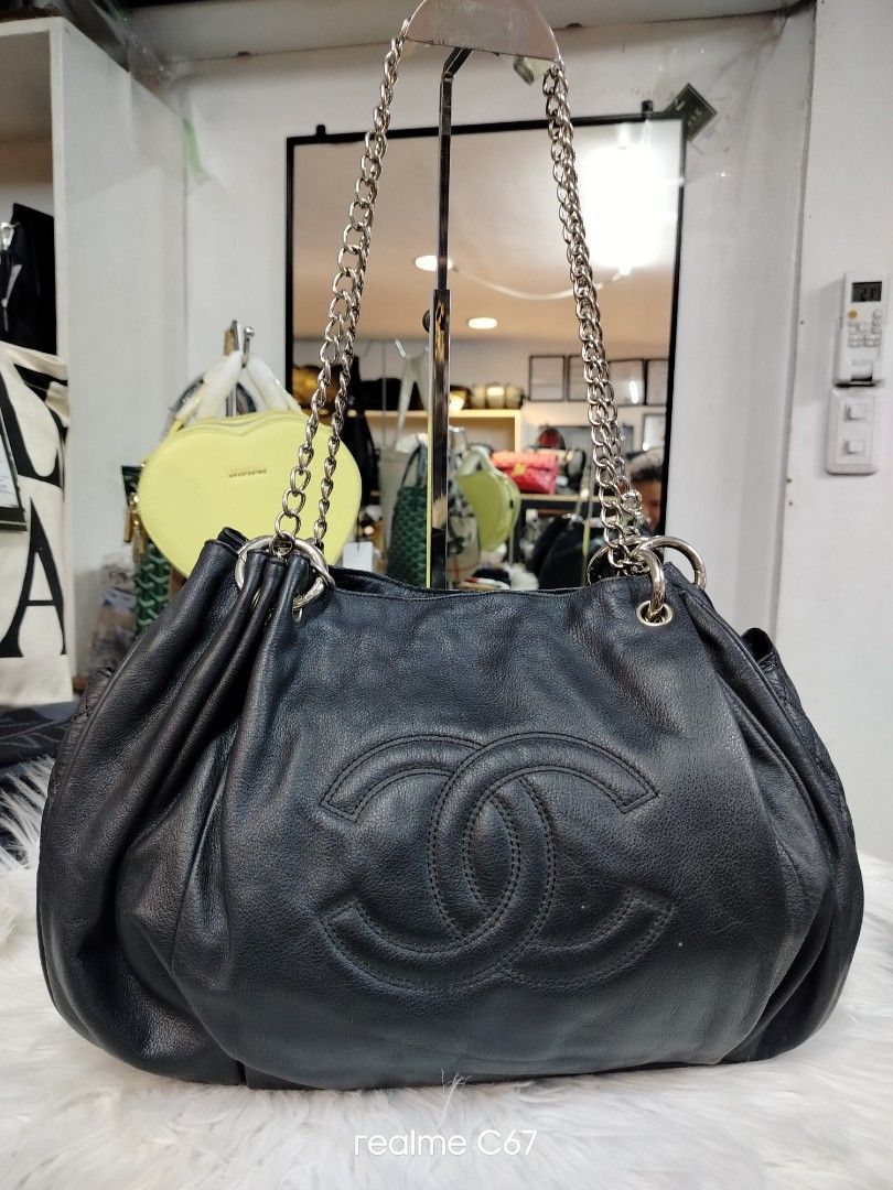 Chanel Black Leather Chain Shoulder Bag (Category: Luxury Bags & Wallets) located in Bacolod City. Submitted by Mike23MattPreloved (Listing ID 1464493268, Image 1). Description: - Genuine black leather Chanel bag - Iconic embossed CC logo on the front - Quilted detail on the side pocket - Elegant silver chain straps - Roomy interior for all your essentials - Versatile for daily wear or special events.