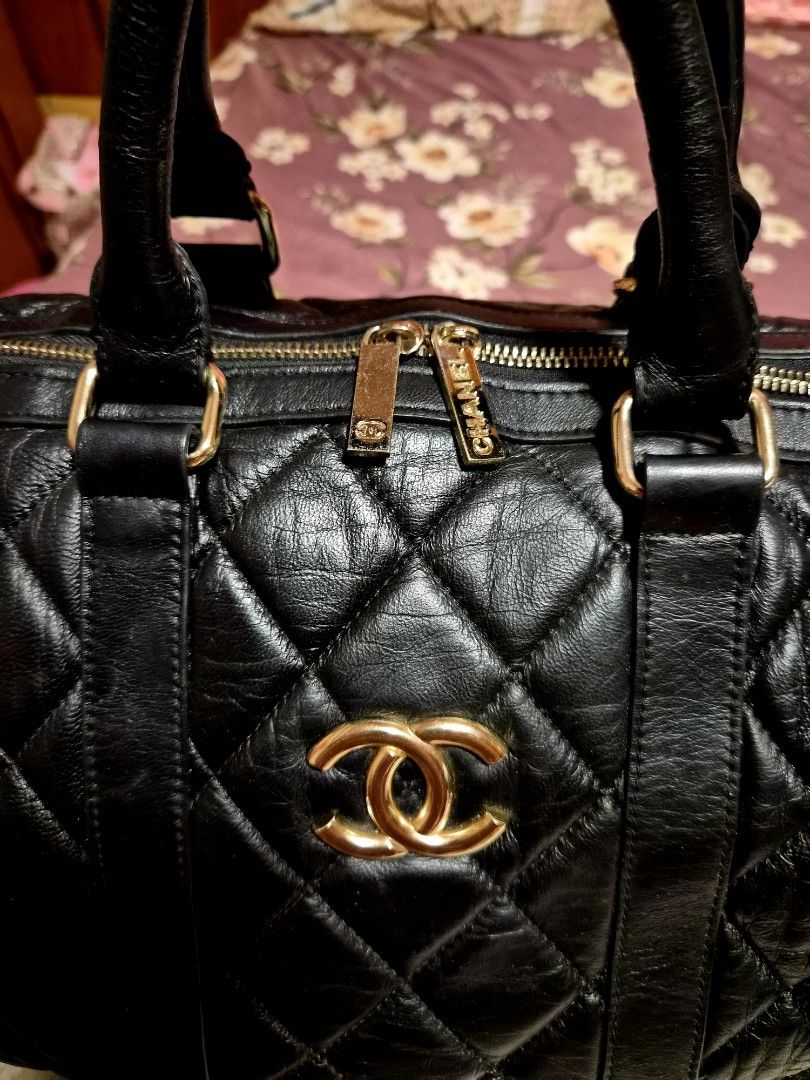 Chanel Black Quilted Leather Boston Bag (Category: Luxury Bags & Wallets) located in Mandaue City. Submitted by chuchi152615 (Listing ID 1464409715, Image 3). Description: - Classic Chanel Boston Bag - Black quilted leather - Gold hardware - Prominent CC logo on front - Chanel branded zippers - Detailed Chanel interior - Ideal size for everyday or travel - Timeless and iconic piece.