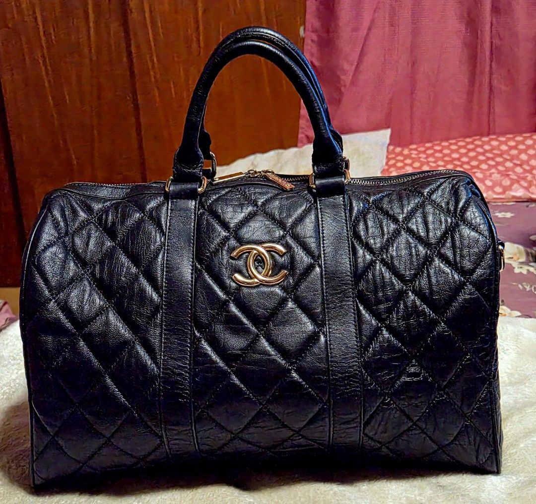 Chanel Black Quilted Leather Boston Bag (Category: Luxury Bags & Wallets) located in Mandaue City. Submitted by chuchi152615 (Listing ID 1464409715, Image 1). Description: - Classic Chanel Boston Bag - Black quilted leather - Gold hardware - Prominent CC logo on front - Chanel branded zippers - Detailed Chanel interior - Ideal size for everyday or travel - Timeless and iconic piece.