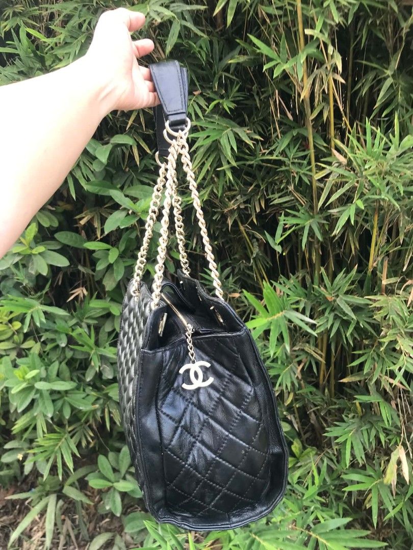 Chanel Black Quilted Leather Chain Shoulder Bag (Category: Tote Bags) located in Midsayap. Submitted by purse_gedo (Listing ID 1462615625, Image 3). Description: - Black Quilted Chanel Bag - Iconic Gold Chain Straps - Signature CC Logo on Front - Interior Chanel Branding - Secure Zipper Closure - Timeless Piece for Any Collection - Versatile for Everyday or Special Occasions.