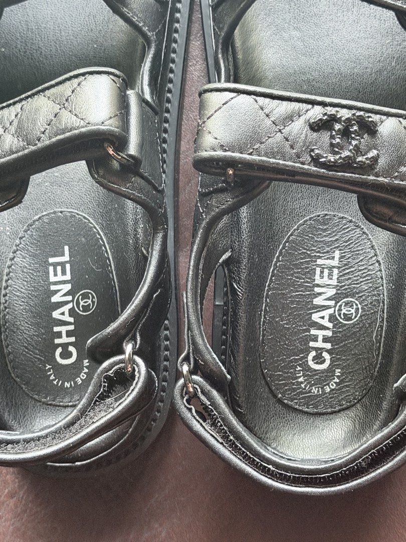 Chanel Black Quilted Leather Sandals (Category: Flats & Sandals) located in Quezon City. Submitted by mariaq97 (Listing ID 1464564804, Image 3). Description: - NOT authentic - Chanel Black Sandals - Quilted Leather Straps with CC Logo Detail - Easy Velcro Closure for Adjustable Fit - Made in Italy - Size: 38 - Soles show minimal wear - Includes Original Box.