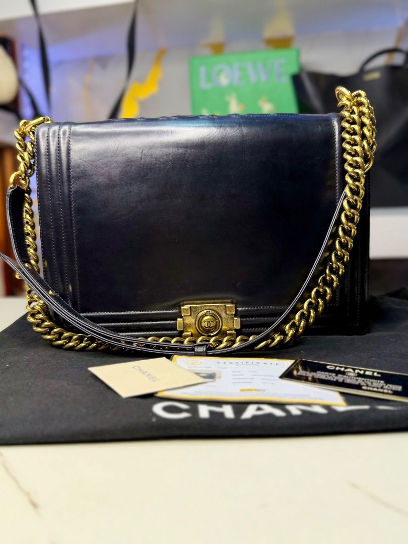 Chanel Boy Bag Black Leather Gold Chain (Category: Luxury Bags & Wallets) located in Caloocan City. Submitted by piamariemo11606 (Listing ID 1464511169, Image 2). Description: - Classic Chanel Boy bag - Black leather with gold hardware - Comes with dust bag and authenticity cards - Perfect for day or night wear - A timeless addition to any collection.