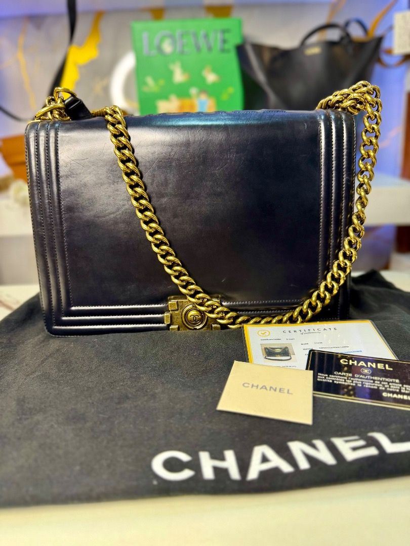Chanel Boy Bag Black Leather Gold Chain (Category: Luxury Bags & Wallets) located in Caloocan City. Submitted by piamariemo11606 (Listing ID 1464511169, Image 1). Description: - Classic Chanel Boy bag - Black leather with gold hardware - Comes with dust bag and authenticity cards - Perfect for day or night wear - A timeless addition to any collection.