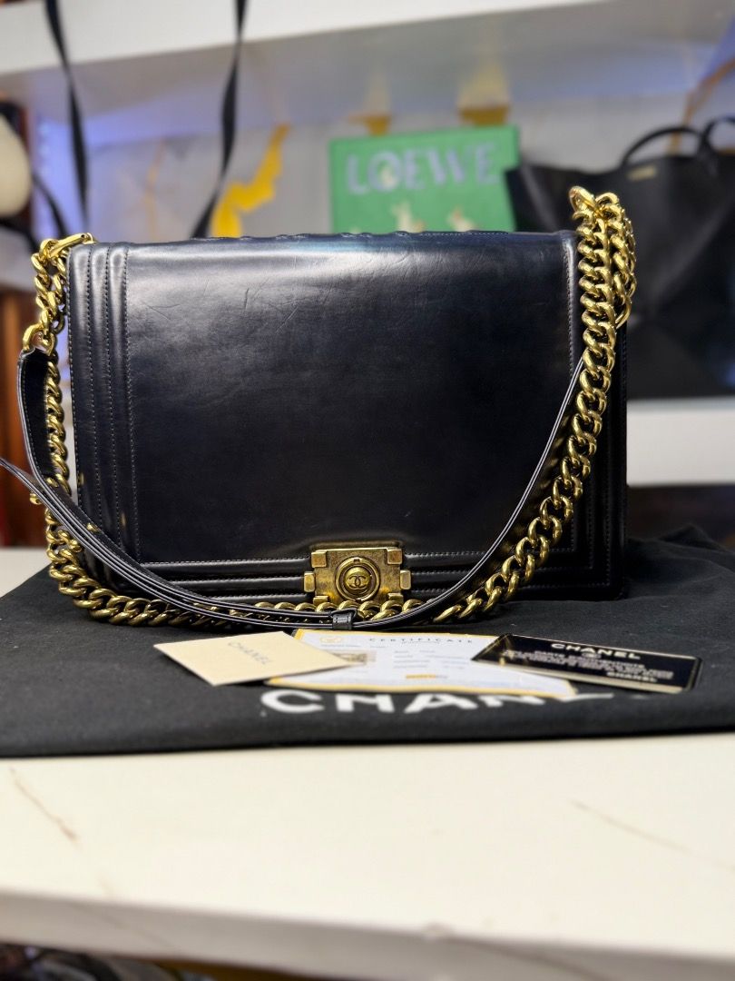Chanel Boy Bag Black Leather Gold Chain (Category: Luxury Bags & Wallets) located in Caloocan City. Submitted by piamariemo11606 (Listing ID 1464511169, Image 3). Description: - Classic Chanel Boy bag - Black leather with gold hardware - Comes with dust bag and authenticity cards - Perfect for day or night wear - A timeless addition to any collection.